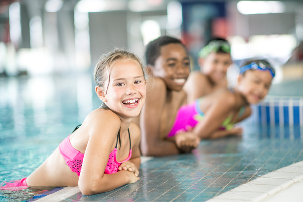 Group of children in swimming lessons